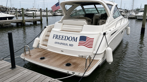 Boat name Freedom with American flag decal