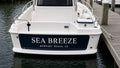 Hailing port decal in white vinyl lettering on a boat transom
