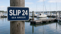 Custom boat slip number sign at a marina dock