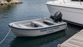 Hard-shell yacht tender with Tender To name and registration number vinyl lettering